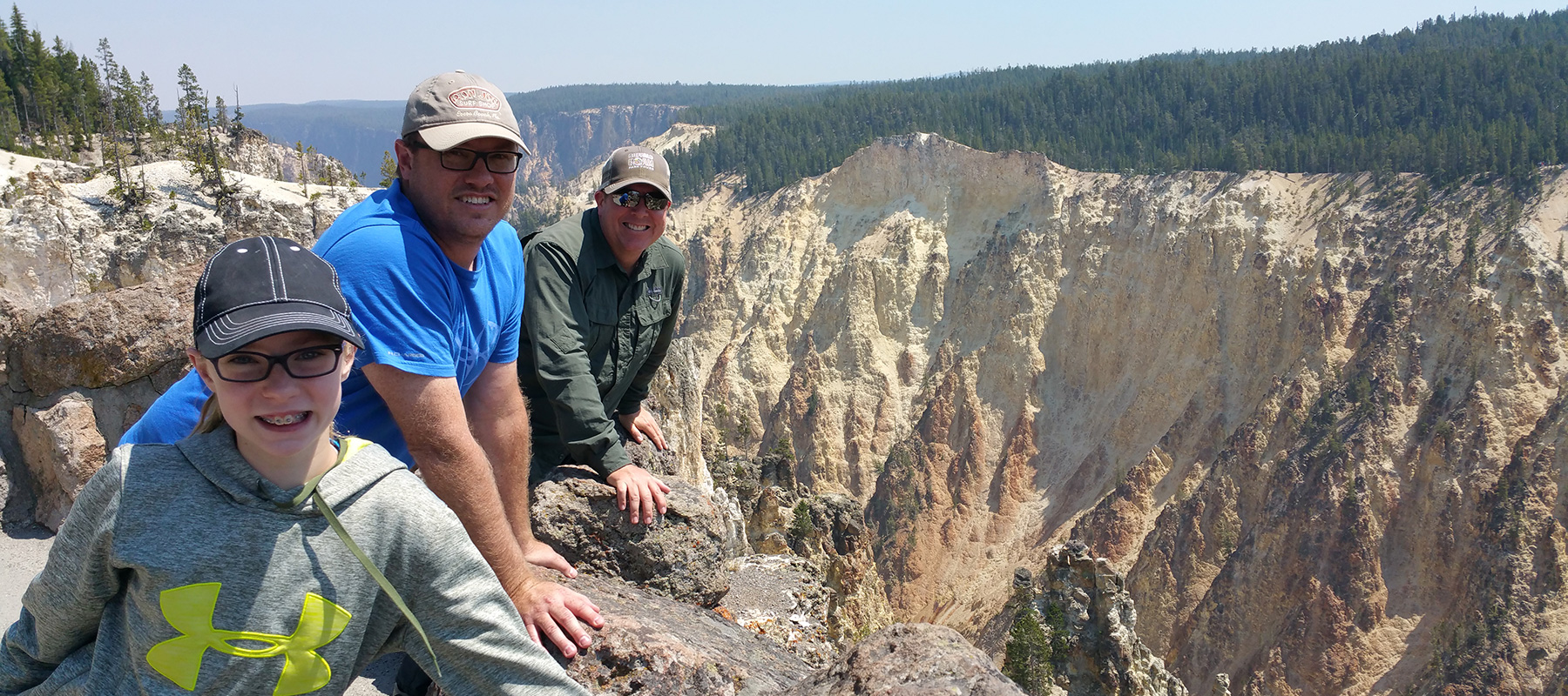 Smiling Private Tour Group at Yellowstone Grand Canyon - Buffalo Roam Tours
