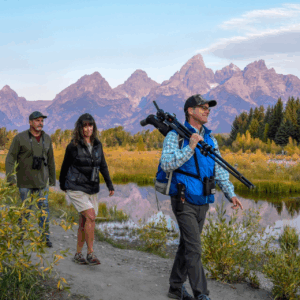 Visitors entering Yellowstone National Park with updated 2026 national park entrance fees signage at the park entrance.