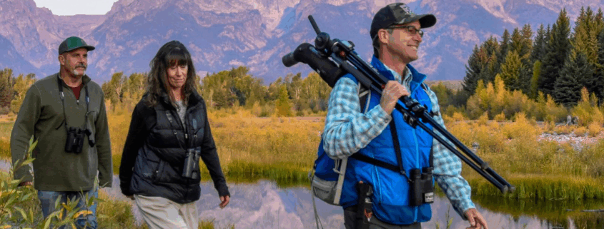 Visitors entering Yellowstone National Park with updated 2026 national park entrance fees signage at the park entrance.