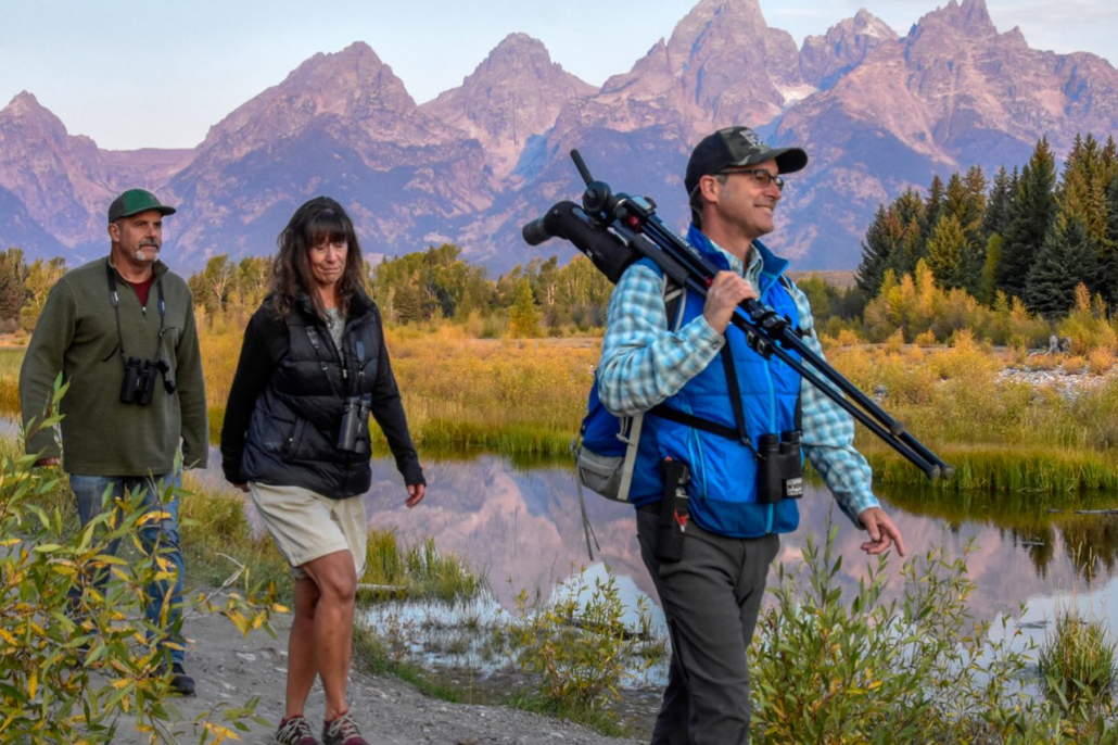 Visitors entering Yellowstone National Park with updated 2026 national park entrance fees signage at the park entrance.