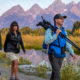 Visitors entering Yellowstone National Park with updated 2026 national park entrance fees signage at the park entrance.